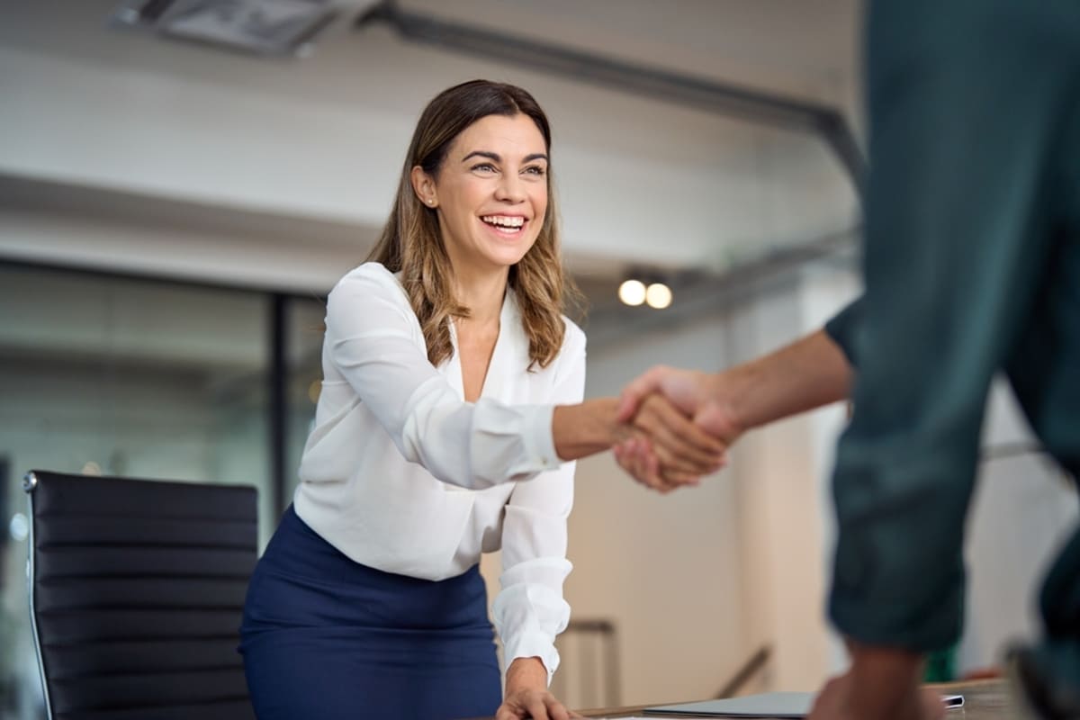 A man shaking hands with a businesswoman-1