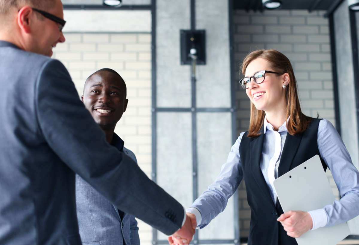 Business people shaking hands, finishing up a meeting