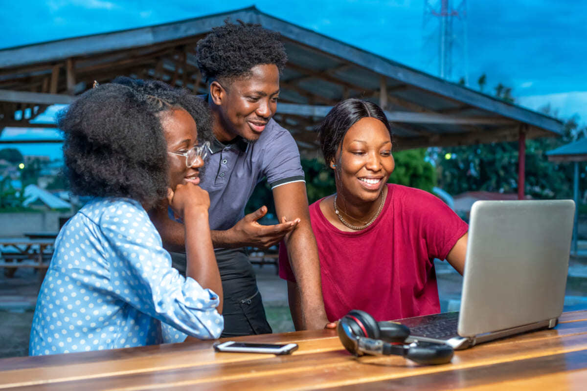 A family looking at a laptop together