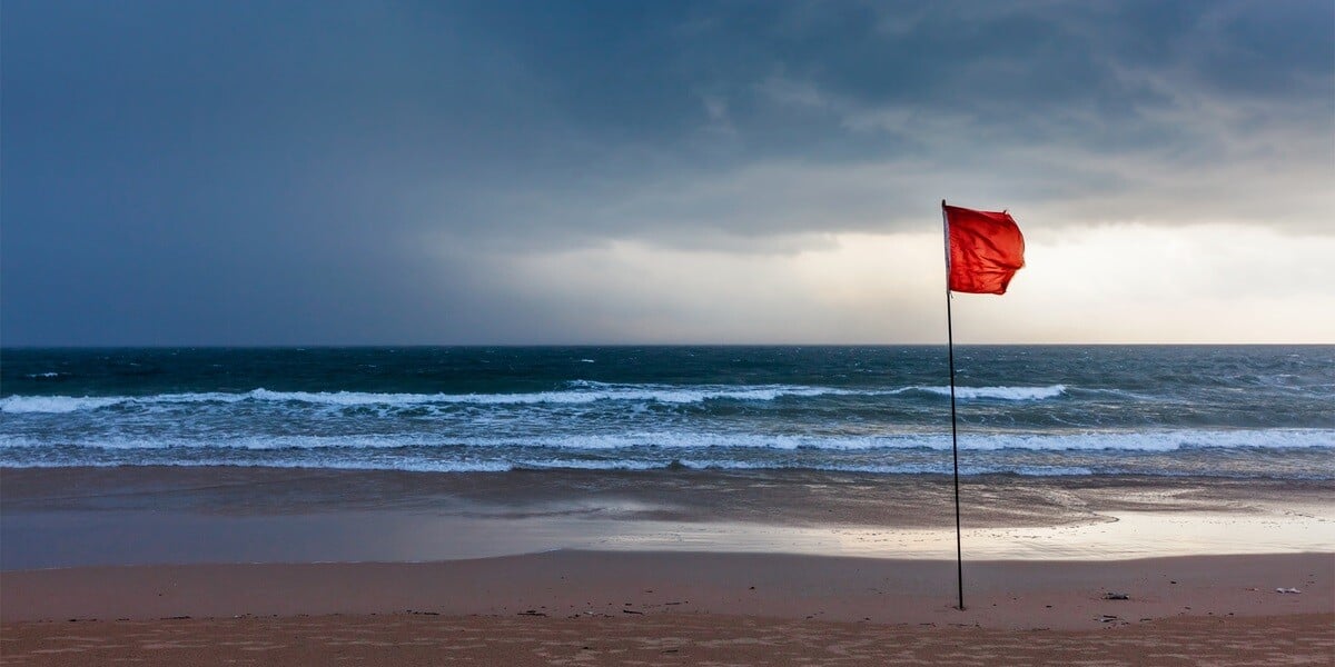 A red flag on the beach